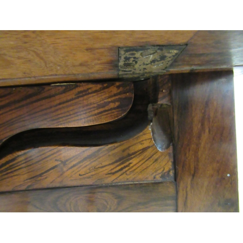 67 - An early 19thC rosewood Pembroke style work table, the fall flaps with round corners, over two shall... 