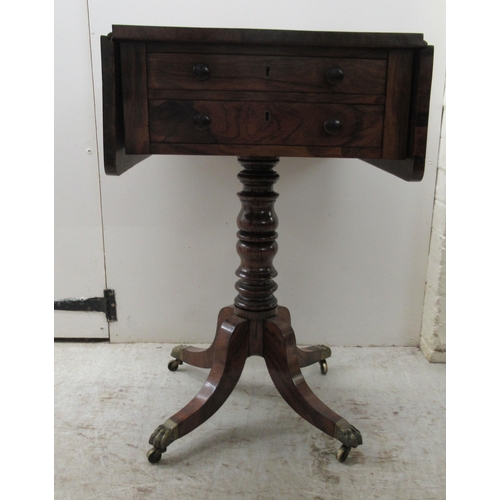 67 - An early 19thC rosewood Pembroke style work table, the fall flaps with round corners, over two shall... 