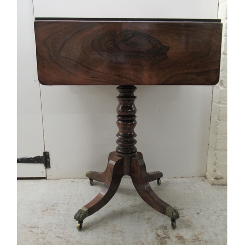 67 - An early 19thC rosewood Pembroke style work table, the fall flaps with round corners, over two shall... 