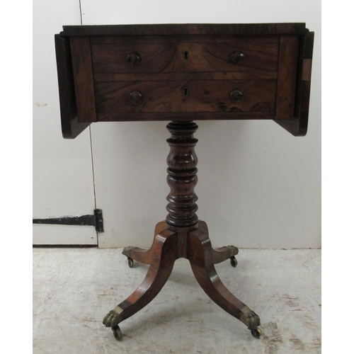 67 - An early 19thC rosewood Pembroke style work table, the fall flaps with round corners, over two shall... 