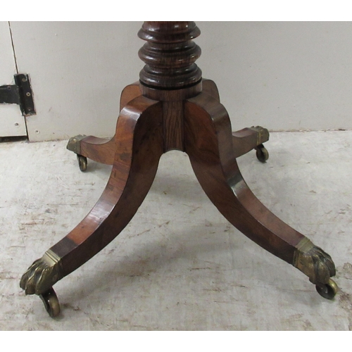 67 - An early 19thC rosewood Pembroke style work table, the fall flaps with round corners, over two shall... 