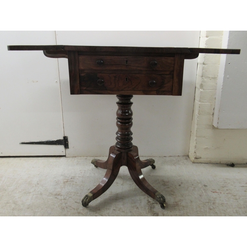 67 - An early 19thC rosewood Pembroke style work table, the fall flaps with round corners, over two shall... 