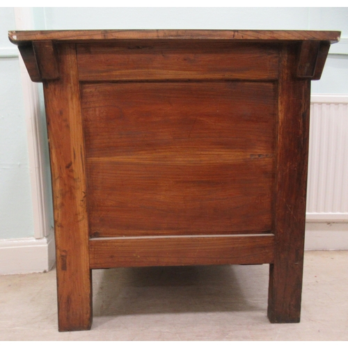 70 - A 20thC Korean elm altar design table/cabinet with a planked rising top, on brackets and an ornately... 