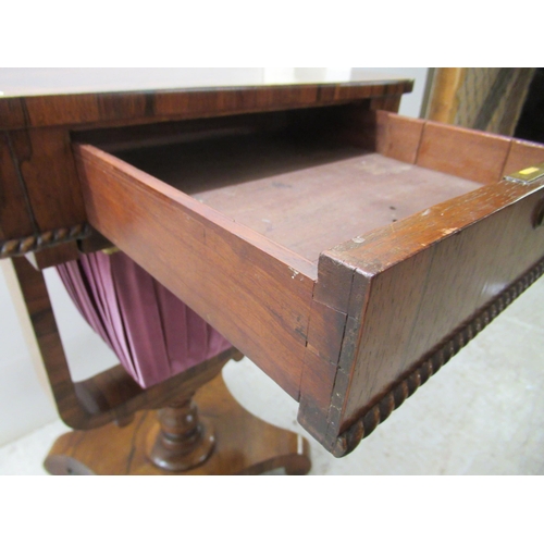 71 - A mid 19thC rosewood work table, the drawer over a retractable, pleated fabric covered wool well, el... 