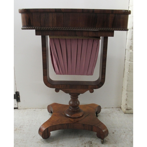 71 - A mid 19thC rosewood work table, the drawer over a retractable, pleated fabric covered wool well, el... 