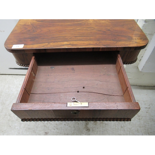 71 - A mid 19thC rosewood work table, the drawer over a retractable, pleated fabric covered wool well, el... 