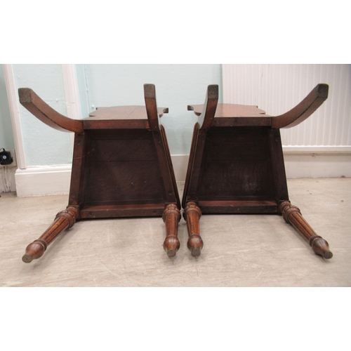 73 - A pair of mid/late 19thC oak framed hall chairs with shield backs, each set with a painted armorial ... 