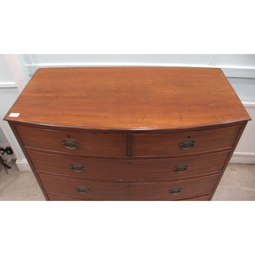 74 - A Victorian mahogany bow front dressing chest with cockbeading and brass bail handles on oval backpl... 