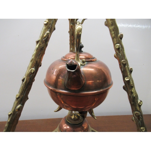 76 - A late 19thC copper and brass kettle and spirit burner, set in a naturalistically cast tripod frame&... 