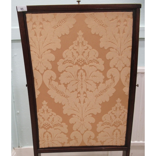 85 - An early 19thC mahogany framed extendable firescreen, the floral fabric covered sliding panels movin... 