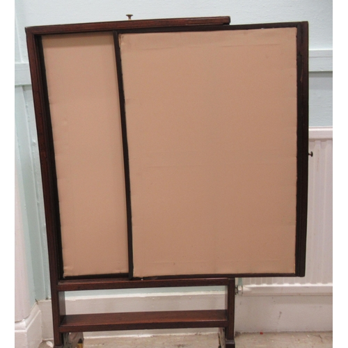 85 - An early 19thC mahogany framed extendable firescreen, the floral fabric covered sliding panels movin... 