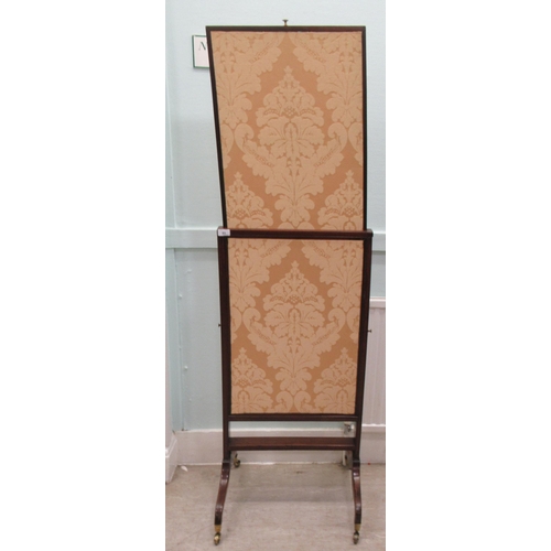 85 - An early 19thC mahogany framed extendable firescreen, the floral fabric covered sliding panels movin... 