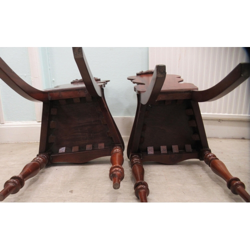 89 - A pair of mid 19thC mahogany hall chairs, the one-piece scroll carved backs with applied and painted... 