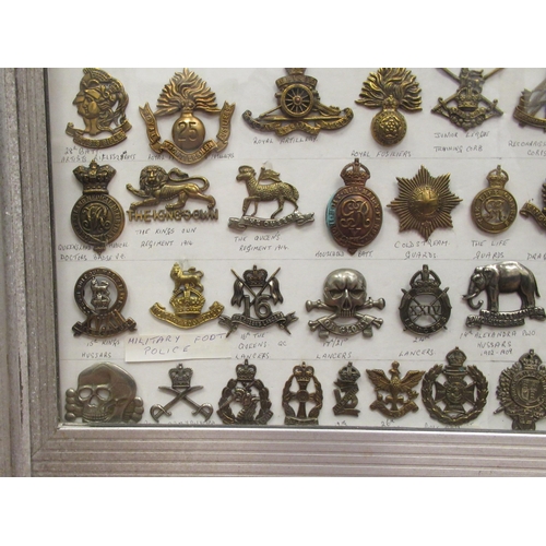 91 - Approx. one hundred military cap badges and other insignia, some copies: to include Royal Armoured C... 