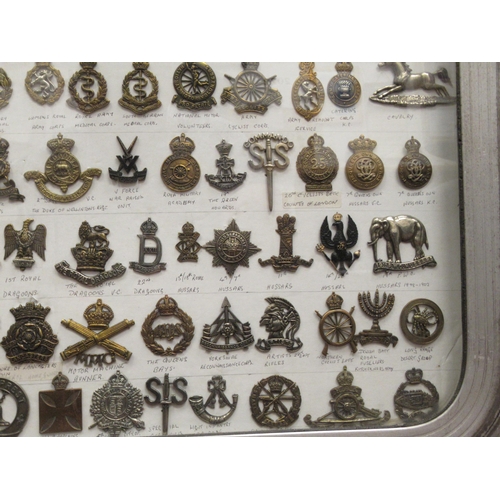 91 - Approx. one hundred military cap badges and other insignia, some copies: to include Royal Armoured C... 