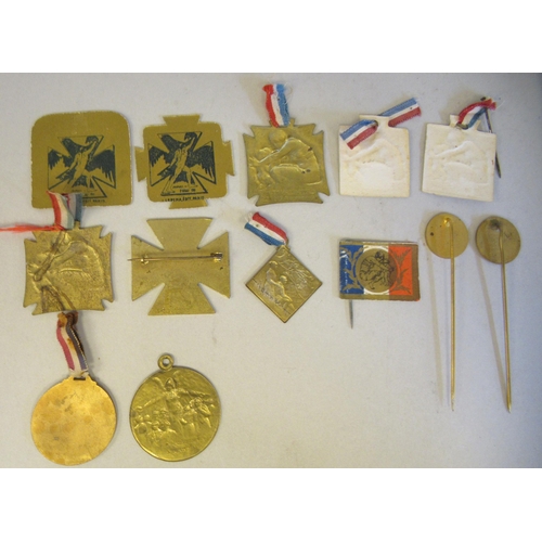 95 - A collection of various Rene Lalique World War I badges, pins and medallions, commissioned by the Fr... 