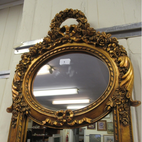 1 - A modern mirror, set in an ornate gilded composition frame  56