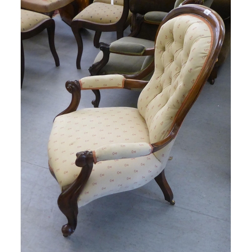 14 - A late Victorian mahogany framed salon chair with a beige fabric upholstered back and seat, raised o... 