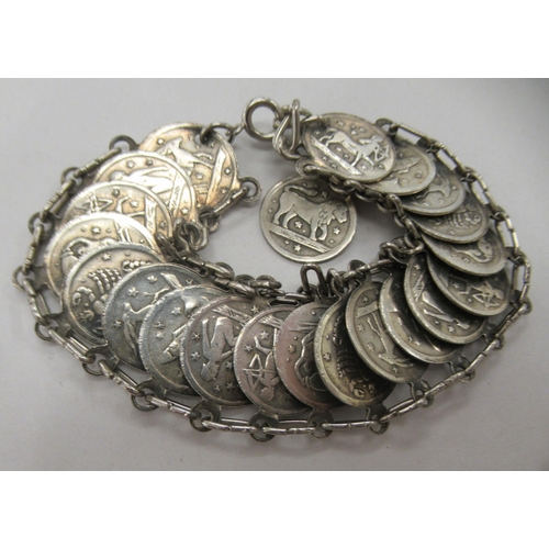 216 - Four dissimilar silver, silver coloured and white metal charm and other bracelets: to include one fa... 