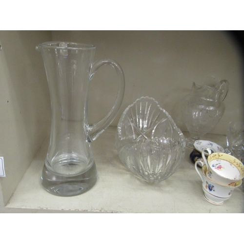 217 - Decorative glassware: to include an ovoid shaped pedestal water jug