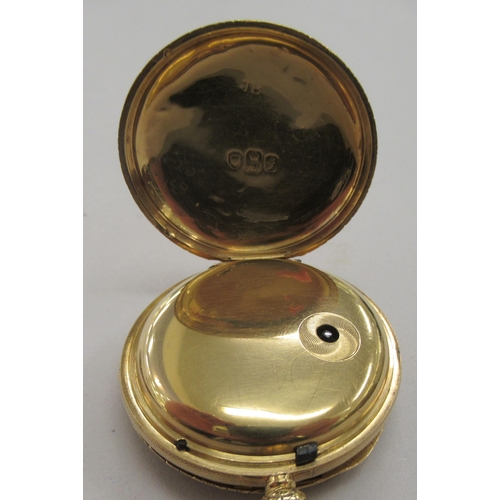 231 - An 18ct gold cased pocket watch with scroll and floral engraved decoration, faced by a decorative gi... 