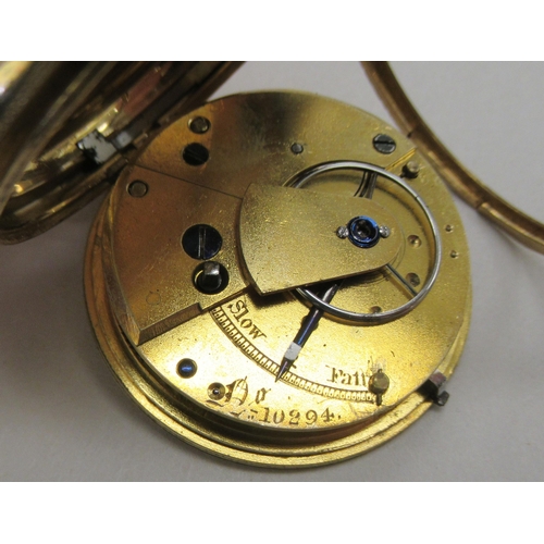 231 - An 18ct gold cased pocket watch with scroll and floral engraved decoration, faced by a decorative gi... 