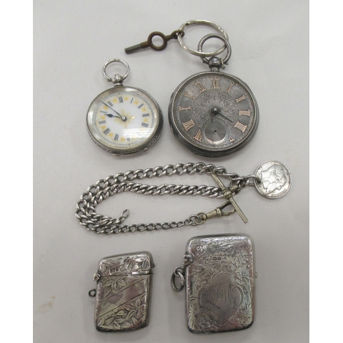 234 - Silver collectables, viz. two similar pendant vesta cases with engraved ornament; a Victorian lady's... 