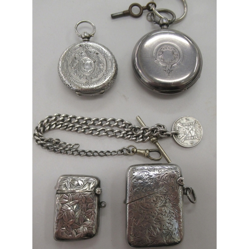 234 - Silver collectables, viz. two similar pendant vesta cases with engraved ornament; a Victorian lady's... 