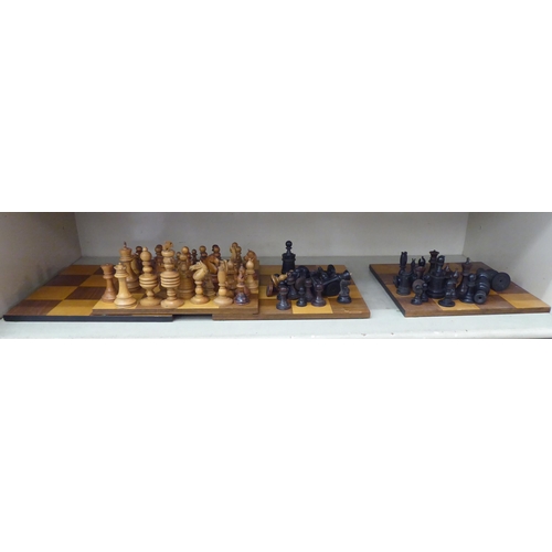 358 - Early 20thC turned chess pieces and square boards