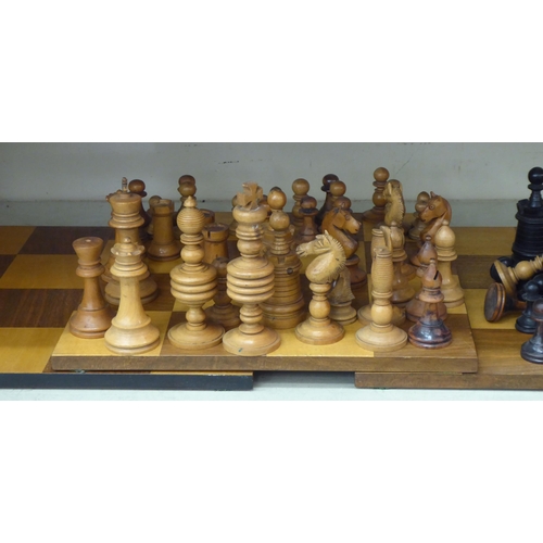 358 - Early 20thC turned chess pieces and square boards