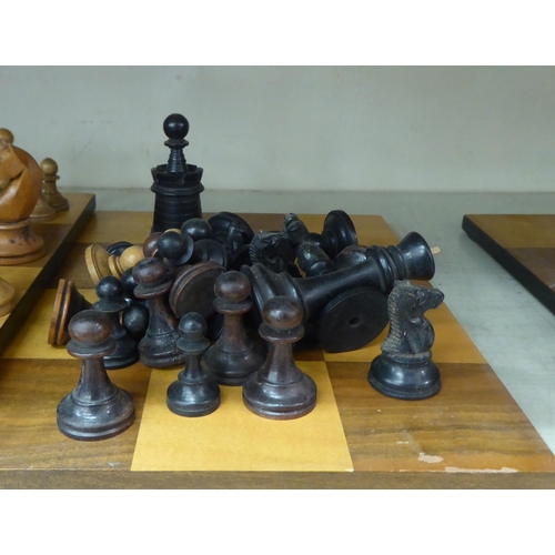 358 - Early 20thC turned chess pieces and square boards