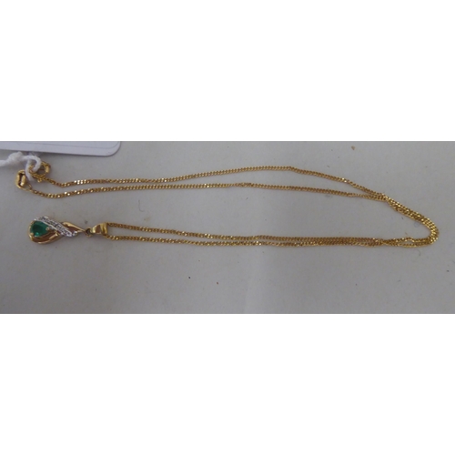 366 - A 9ct gold enamelled and diamond set pendant, on a fine neckchain  