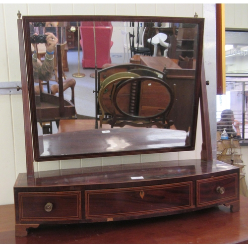 65 - A Regency mahogany framed toilet mirror, on a bow front three drawer box base  29