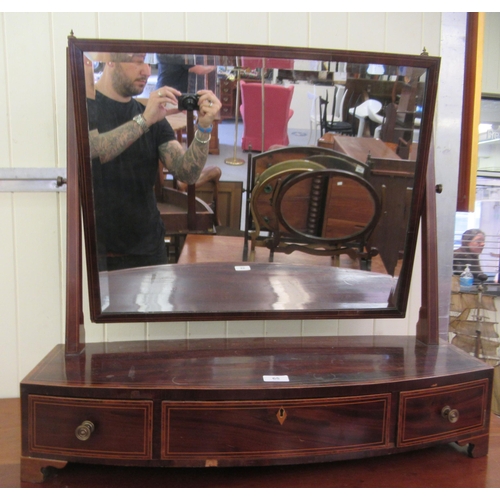 65 - A Regency mahogany framed toilet mirror, on a bow front three drawer box base  29