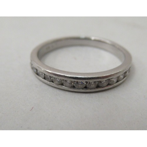 368 - A white coloured gold diamond set half eternity ring