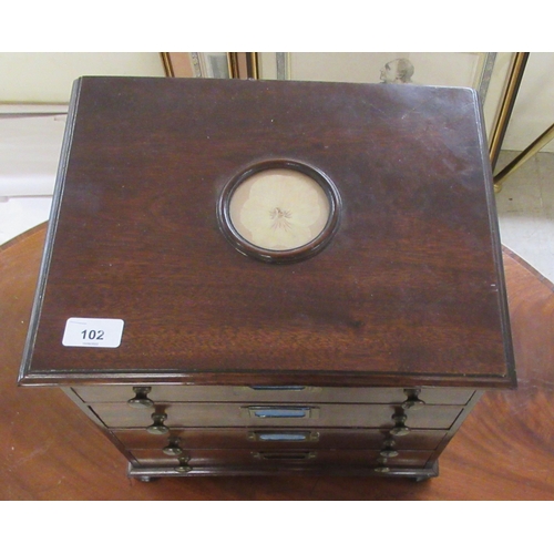 102 - A mid 20thC mahogany four drawer collectors chest, on a plinth and turned bun feet 13.5