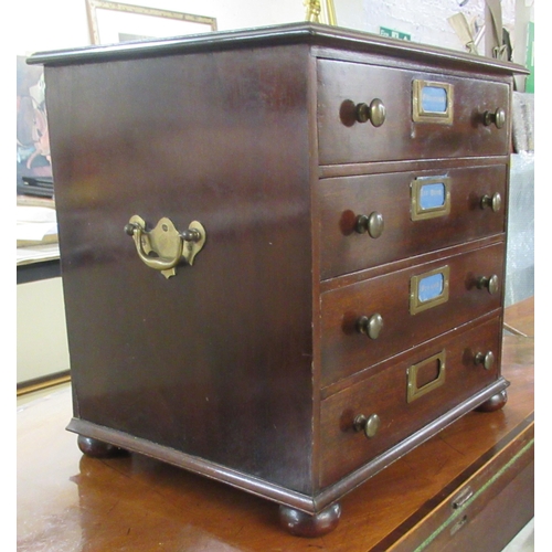 102 - A mid 20thC mahogany four drawer collectors chest, on a plinth and turned bun feet 13.5