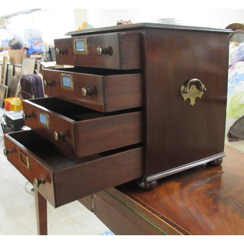 102 - A mid 20thC mahogany four drawer collectors chest, on a plinth and turned bun feet 13.5