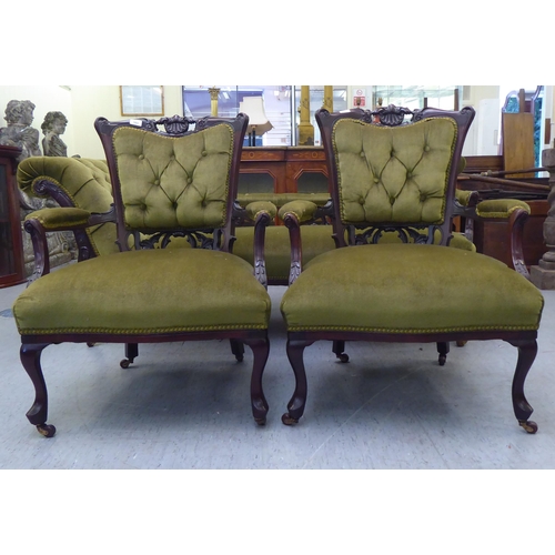 103 - A late Victorian mahogany showwood framed salon suite with foliate and shell carved ornament, uphols... 