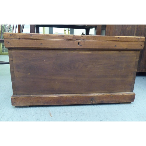 109 - A stained pitch pine box with straight sides, iron flank handles and a hinged lid  20