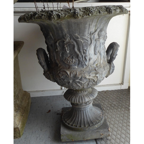 11 - A late 19thC lead, twin handled, pedestal terrace vase, decorated with frieze figures  21