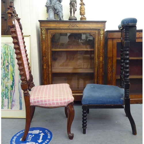 117 - A late Victorian black stained showwood framed prie dieu, upholstered in studded blue dralon and inc... 