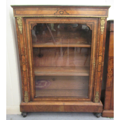 127 - A late Victorian walnut and ebonised marquetry pier cabinet with gilt metal mounts, enclosed by a fu... 