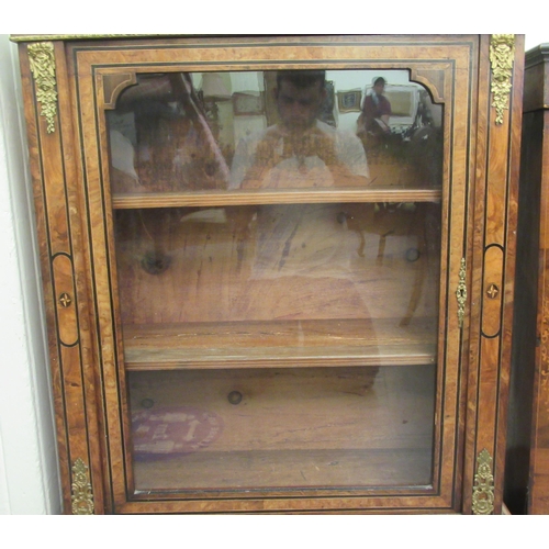 127 - A late Victorian walnut and ebonised marquetry pier cabinet with gilt metal mounts, enclosed by a fu... 