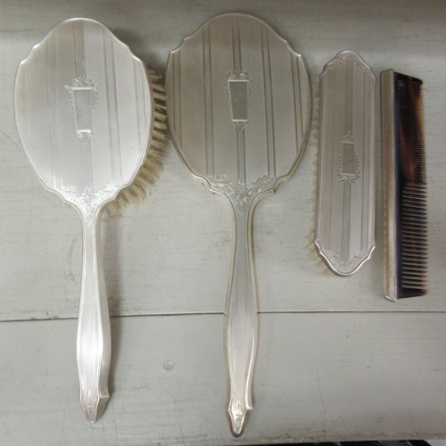 142 - A four piece silver backed dressing table set  Birmingham 1959 