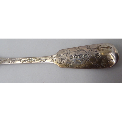 145 - A late Victorian two piece silver Christening presentation set, a spoon and fork, decorated with fol... 