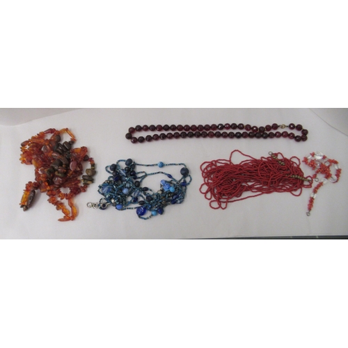 146 - Coral, amber and other irregularly cut bead necklaces and bevelled glass beads 