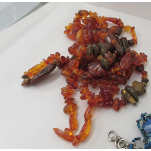 146 - Coral, amber and other irregularly cut bead necklaces and bevelled glass beads 