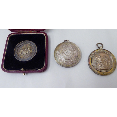 147 - Three medals: to include The Buchannan Trophy of 1925 