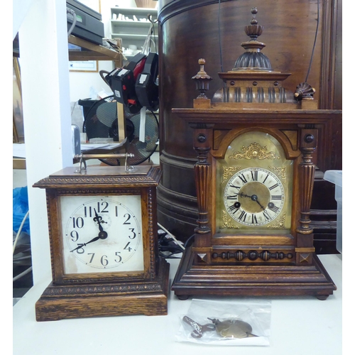 153 - An early 20thC walnut cased mantel clock; the 8 day movement faced by a Roman dial  19